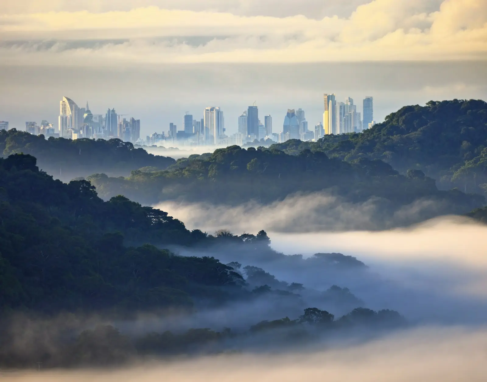 Panama City skyline beyond misty rainforest hills – Panama Golden Visa