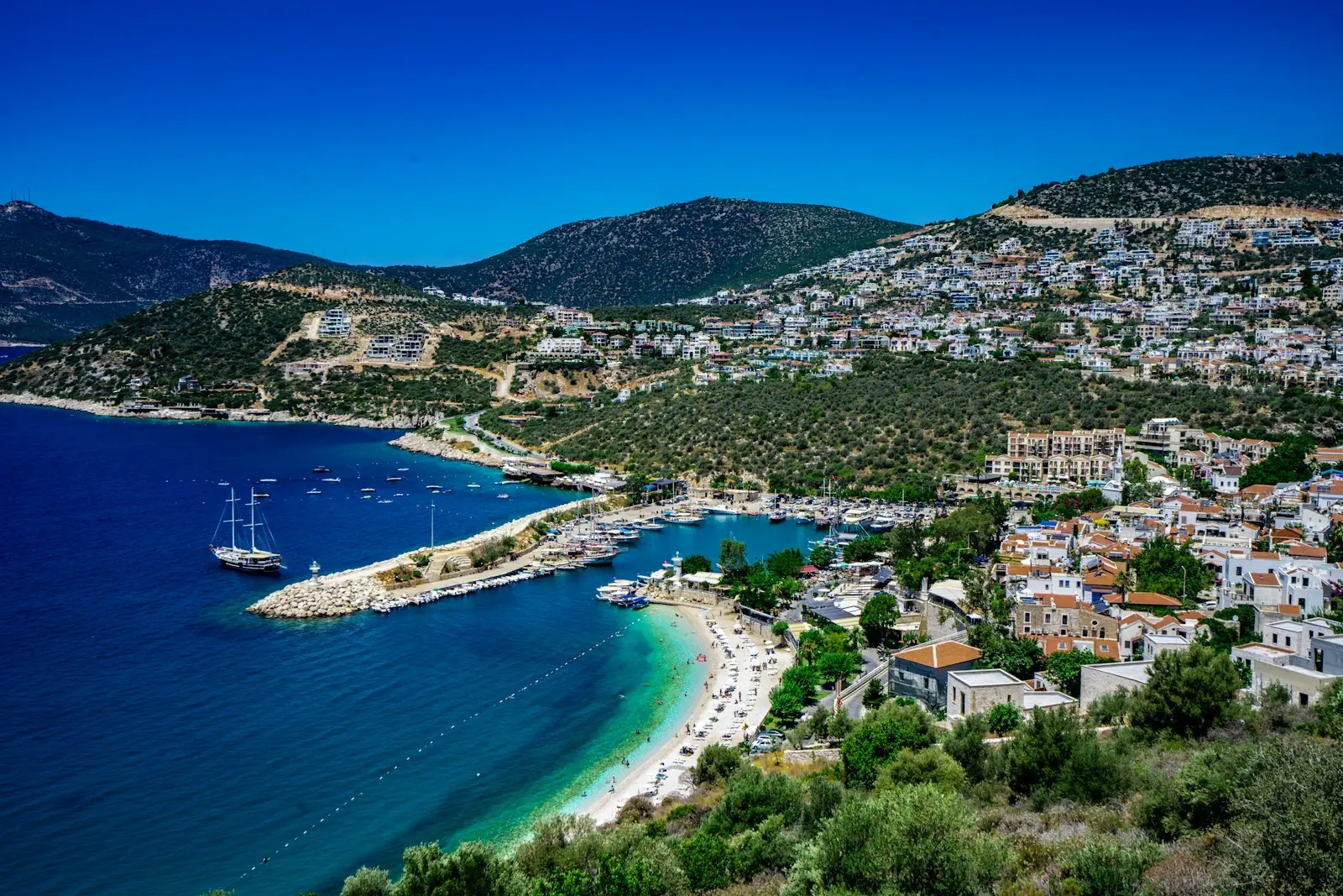 Hillside homes above a bay on the Antalya coast, Turkey – Turkey Citizenship by Investment