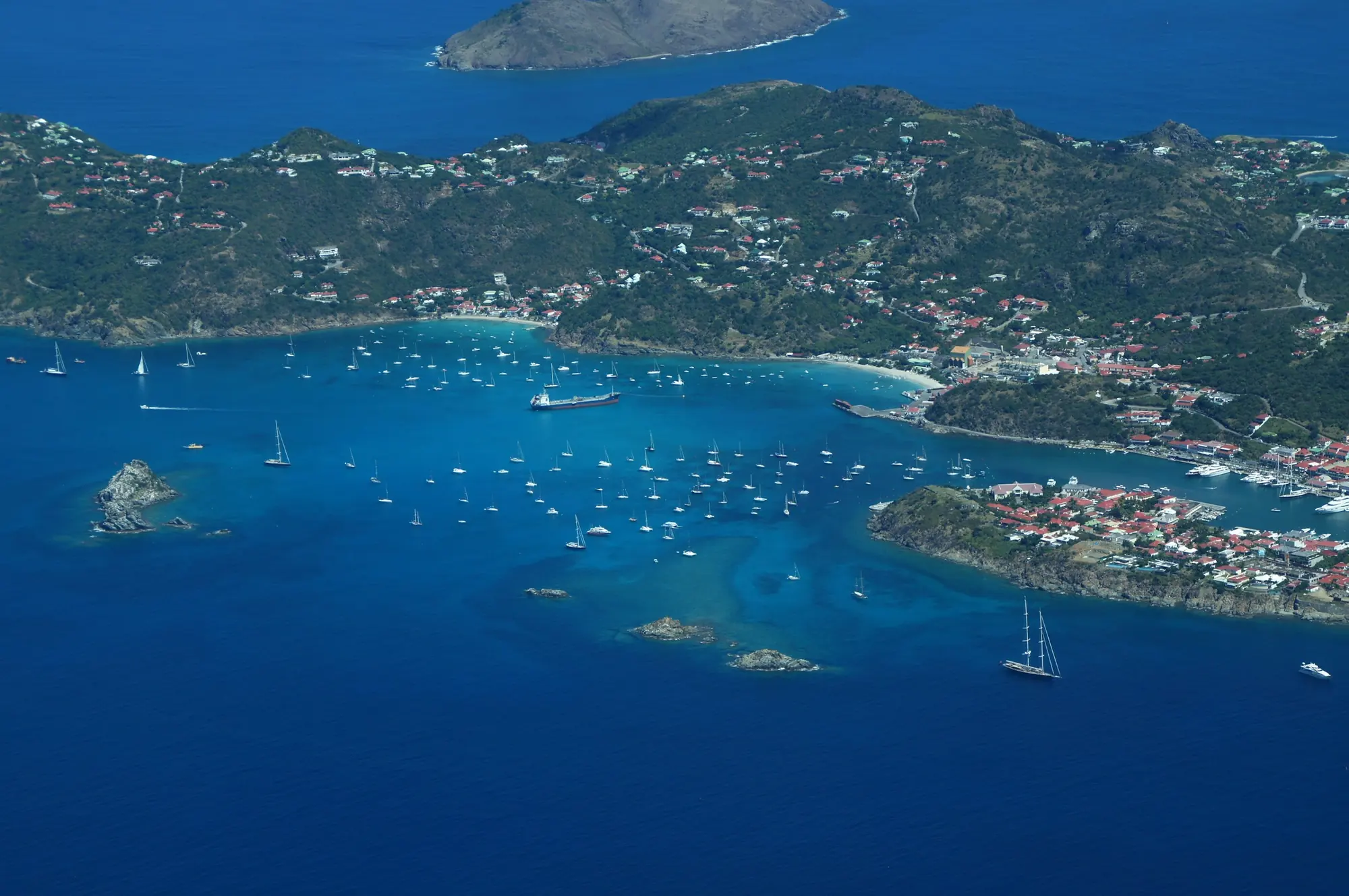 Aerial view of the St Kitts coast, its bays and hillside homes – St Kitts and Nevis citizenship by investment